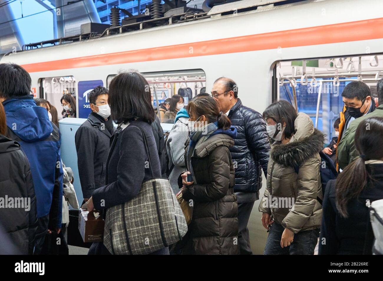 Japanese people wearing surgical masks to prevent infection by the