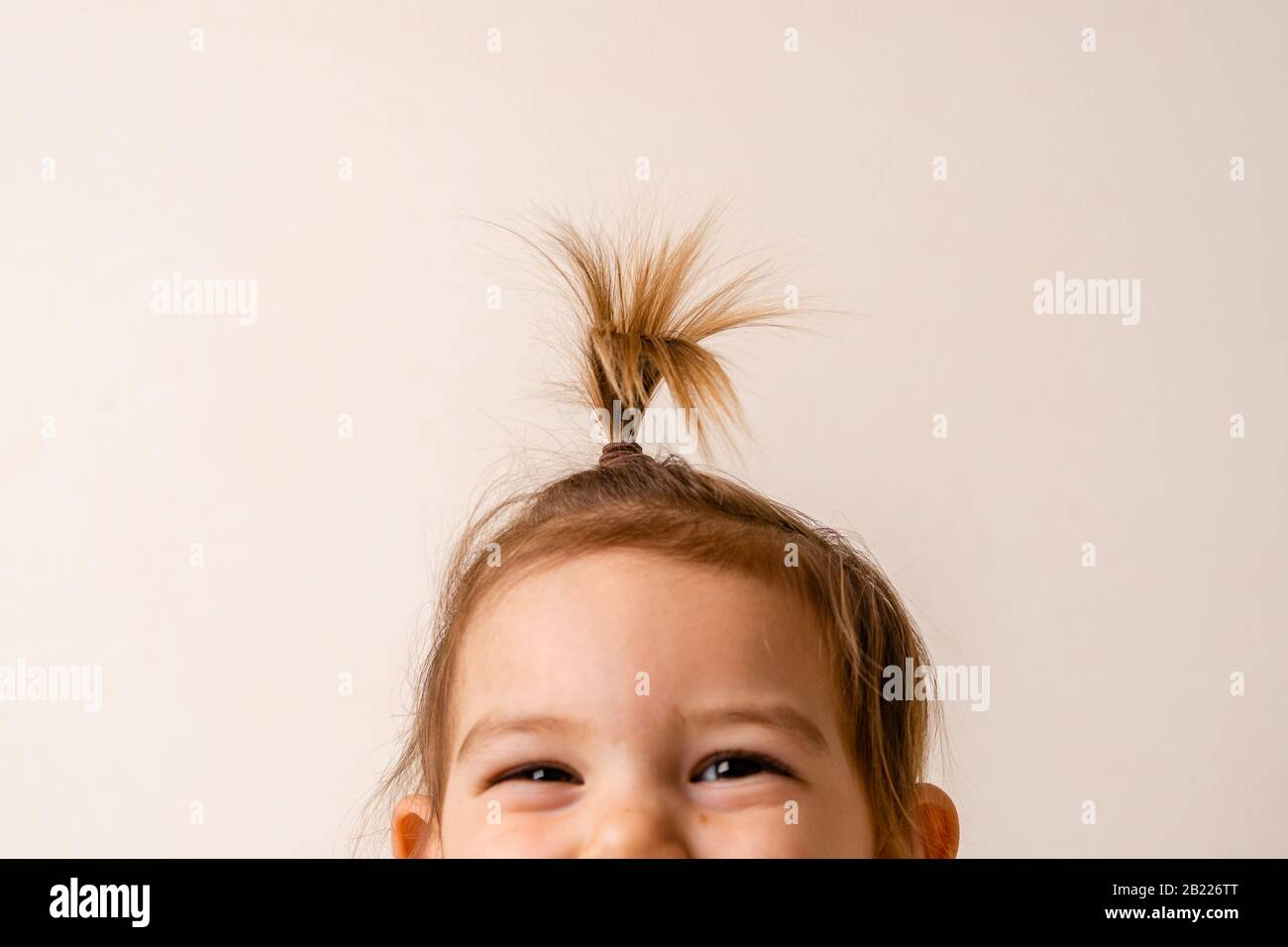 baby first ponytail, hairstyle for toddler girl. minimal concept Stock  Photo - Alamy