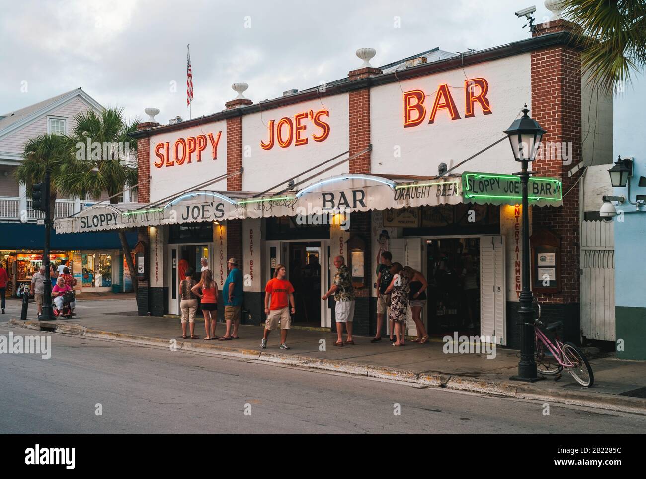 Key West, Florida, United States - July 12 2012: Sloppy Joes Bar in the Evening with Illuminated Sign and Crowds of Tourists. A Famous Bar in Key West Stock Photo