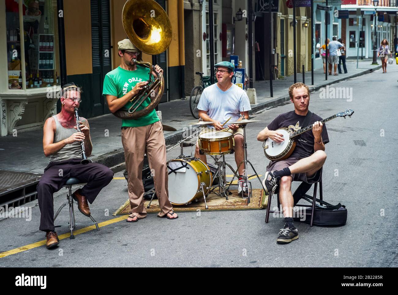 New Orleans, Louisiana, United States - July 17 2009: Jazz Band with Sousaphone, Clarinet, Banjo and Drums Playing Outdoors on Bourbon Street. Stock Photo