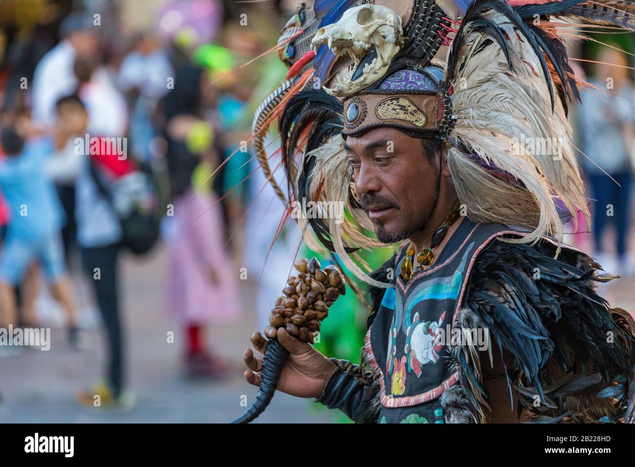 MEXICO CITY, MEXICO - FEBRUARY 17, 2020: Aztec dancers in traditional costumes dancing in the Zocalo in Mexico City, DF, Mexico. Stock Photo
