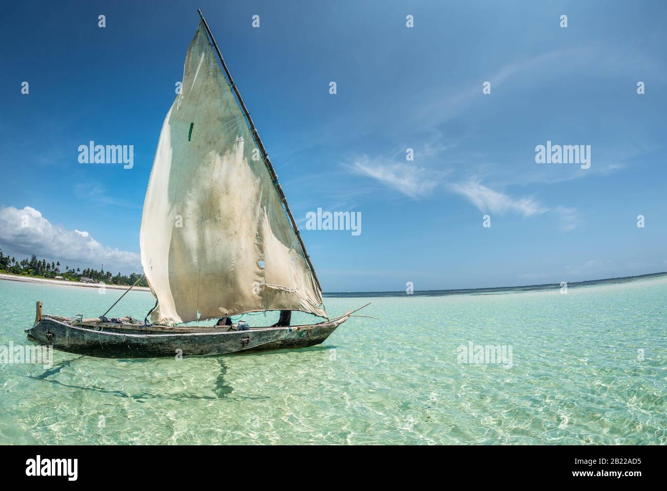 travelling Africa Kenya and Zanzibar seascape with crystal clear turquoise water and traditional sail boat landscape from Diani Beach and Watamu Stock Photo
