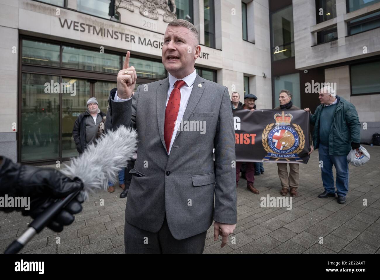 Britain First leader Paul Golding speaks to press outside Westminster Magistrates Court after being charged under Section 7 of the Terrorism Act, UK. Stock Photo