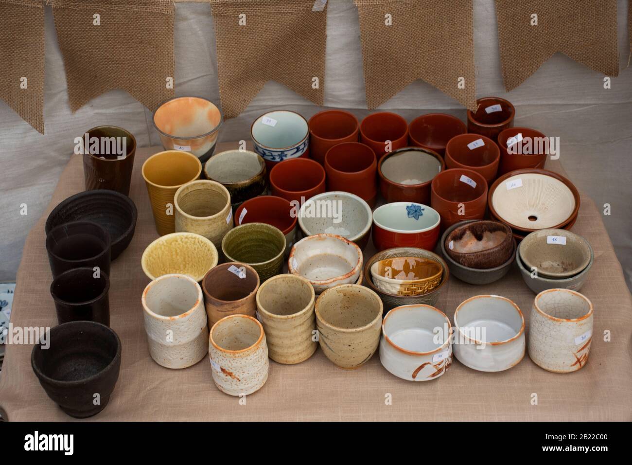 Sculpture ceramic tea cup and pot tea art for sale travelers people buy at street market in Bangkok, Thailand Stock Photo