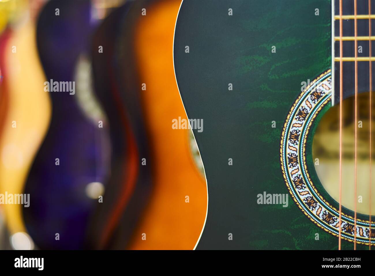 Row of classic acoustic guitars in the store Stock Photo Alamy