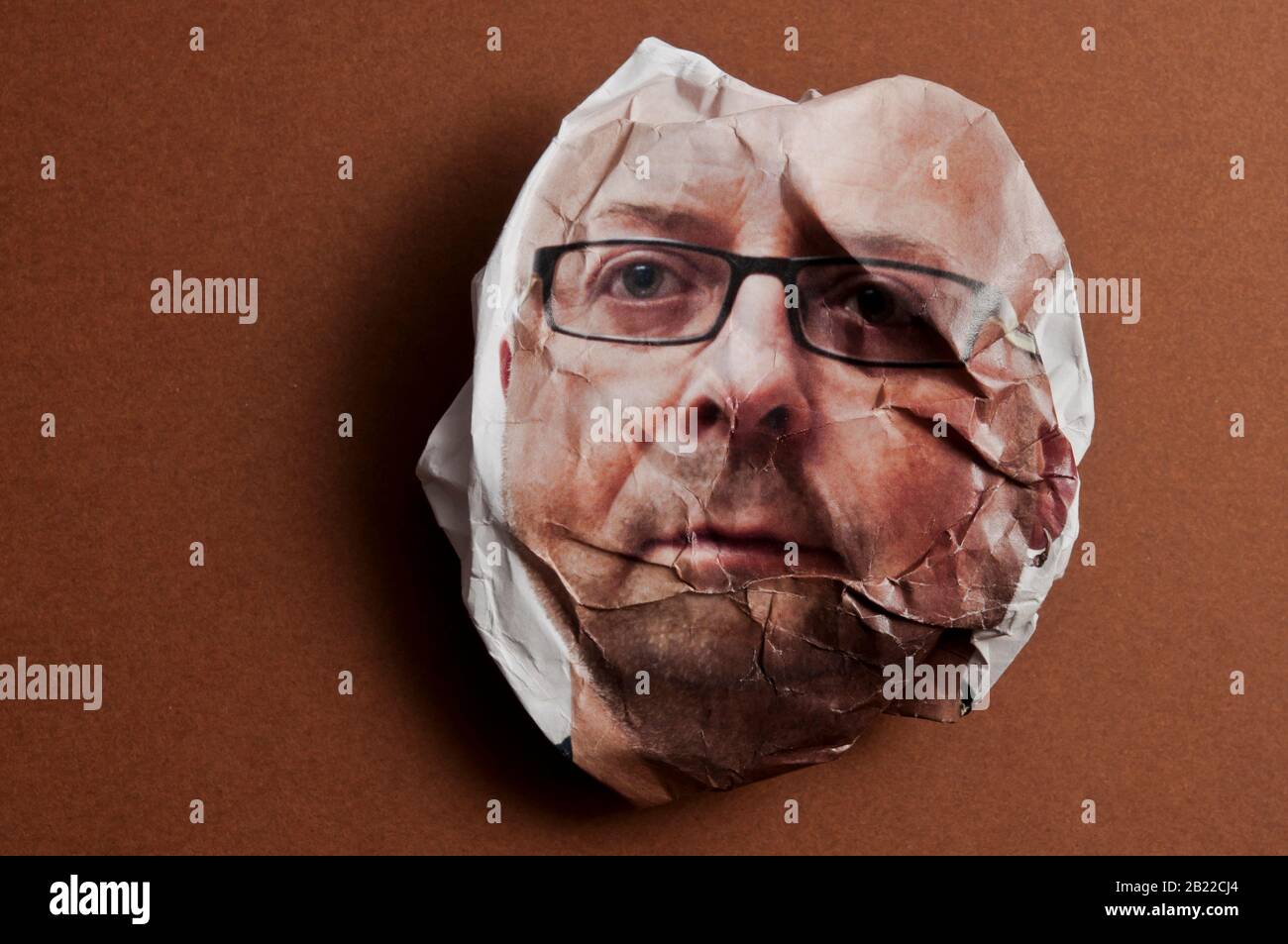 crumpled photo portrait of a man, concept for ageing Stock Photo