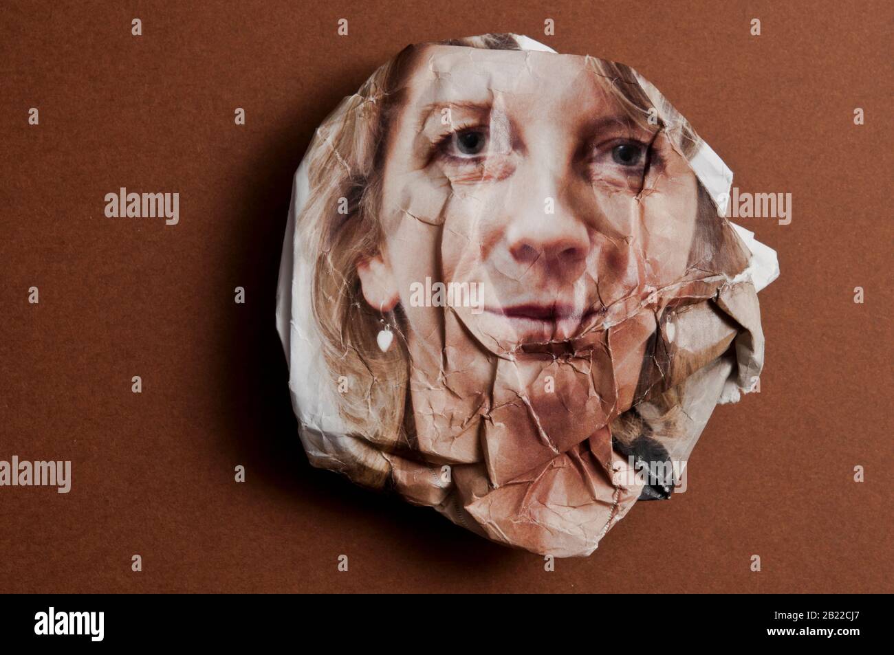 crumpled photo portrait of a woman, concept for ageing Stock Photo