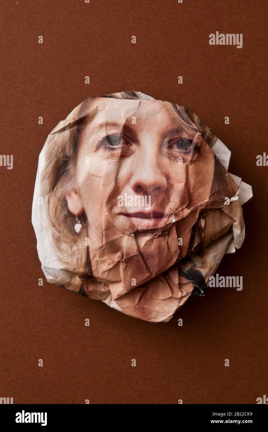 crumpled photo portrait of a woman, concept for ageing Stock Photo