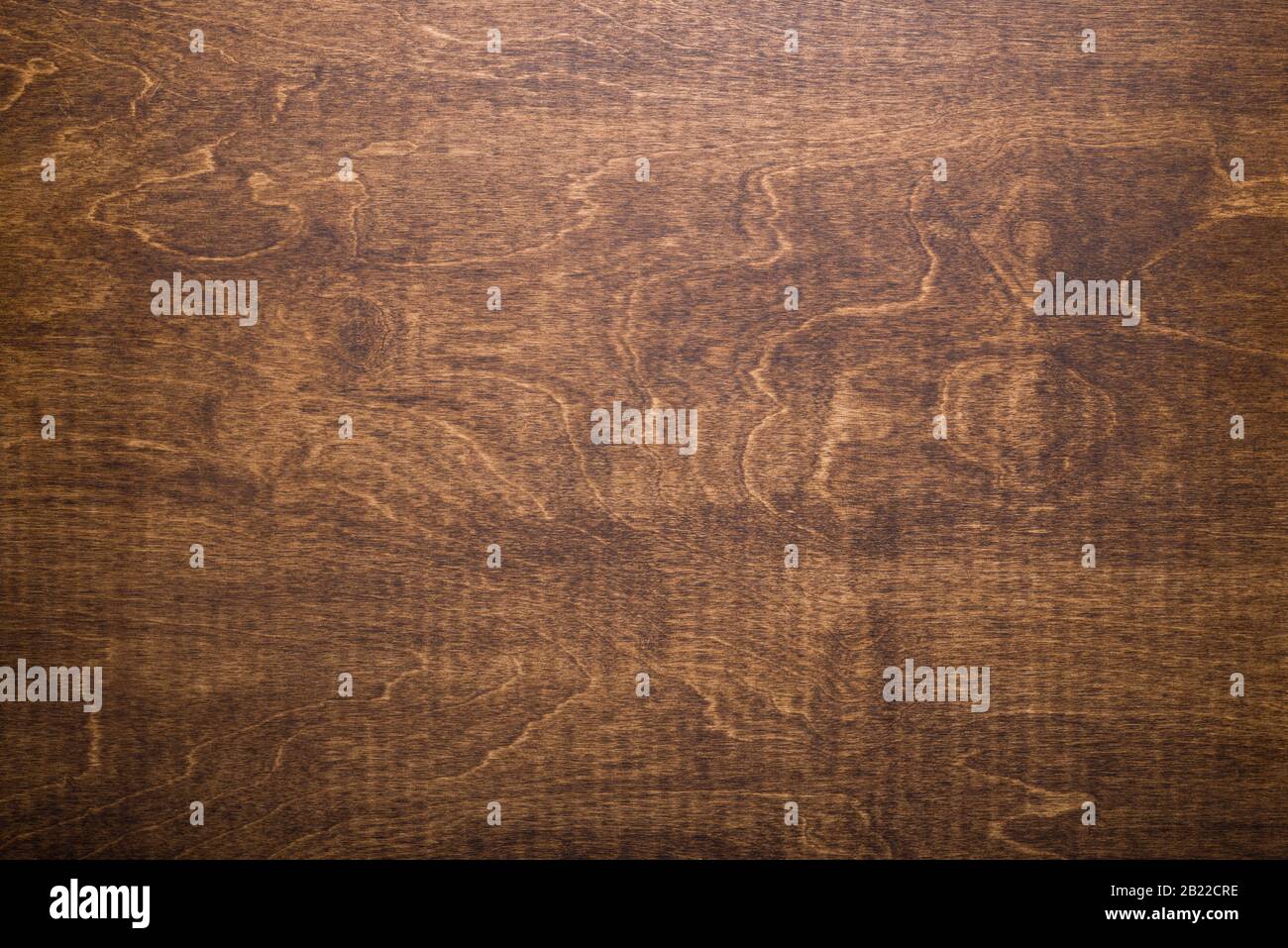 Dark brown wooden tabletop made of plywood. Stock Photo