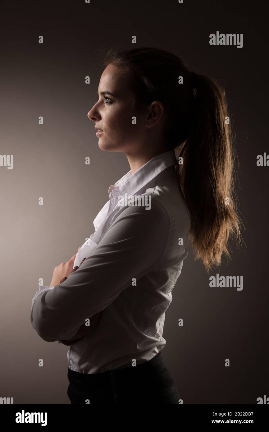 Corporate portrait of business woman over dark gray background Stock ...