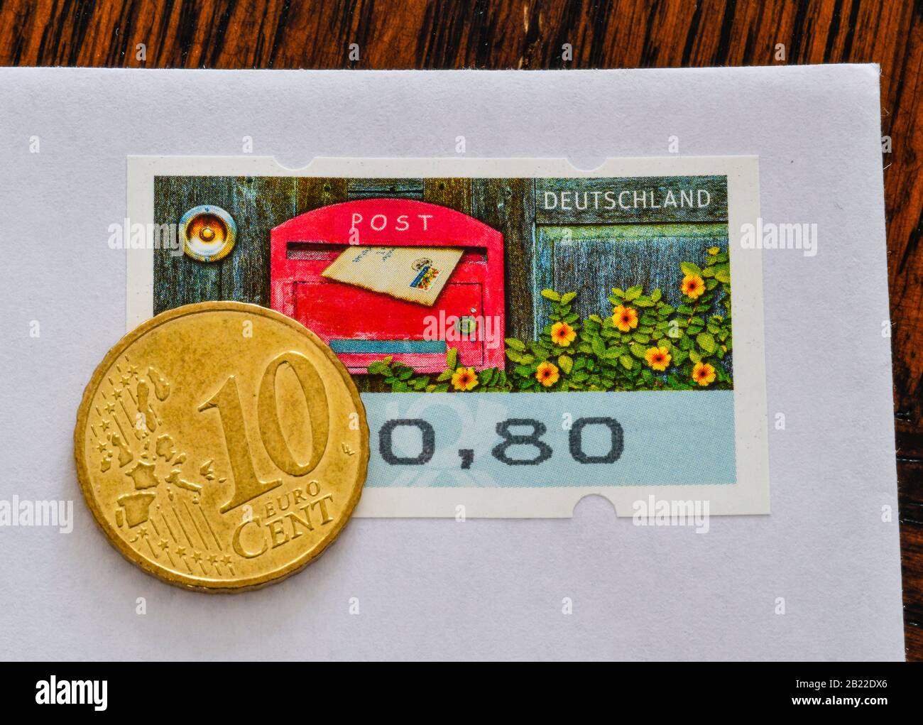 Deutsche Briefmarke 80 Cent und 10 Centmünze, Symbolfoto Portoerhöhung Stock Photo