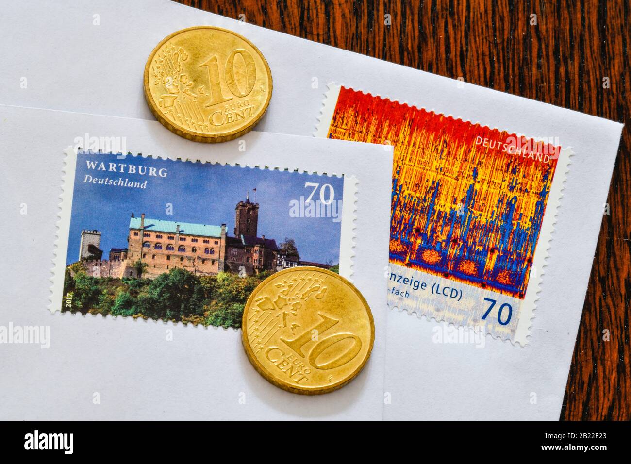 Deutsche Briefmarken 70 Cent und 10 Centmünzen, Symbolfoto Portoerhöhung Stock Photo