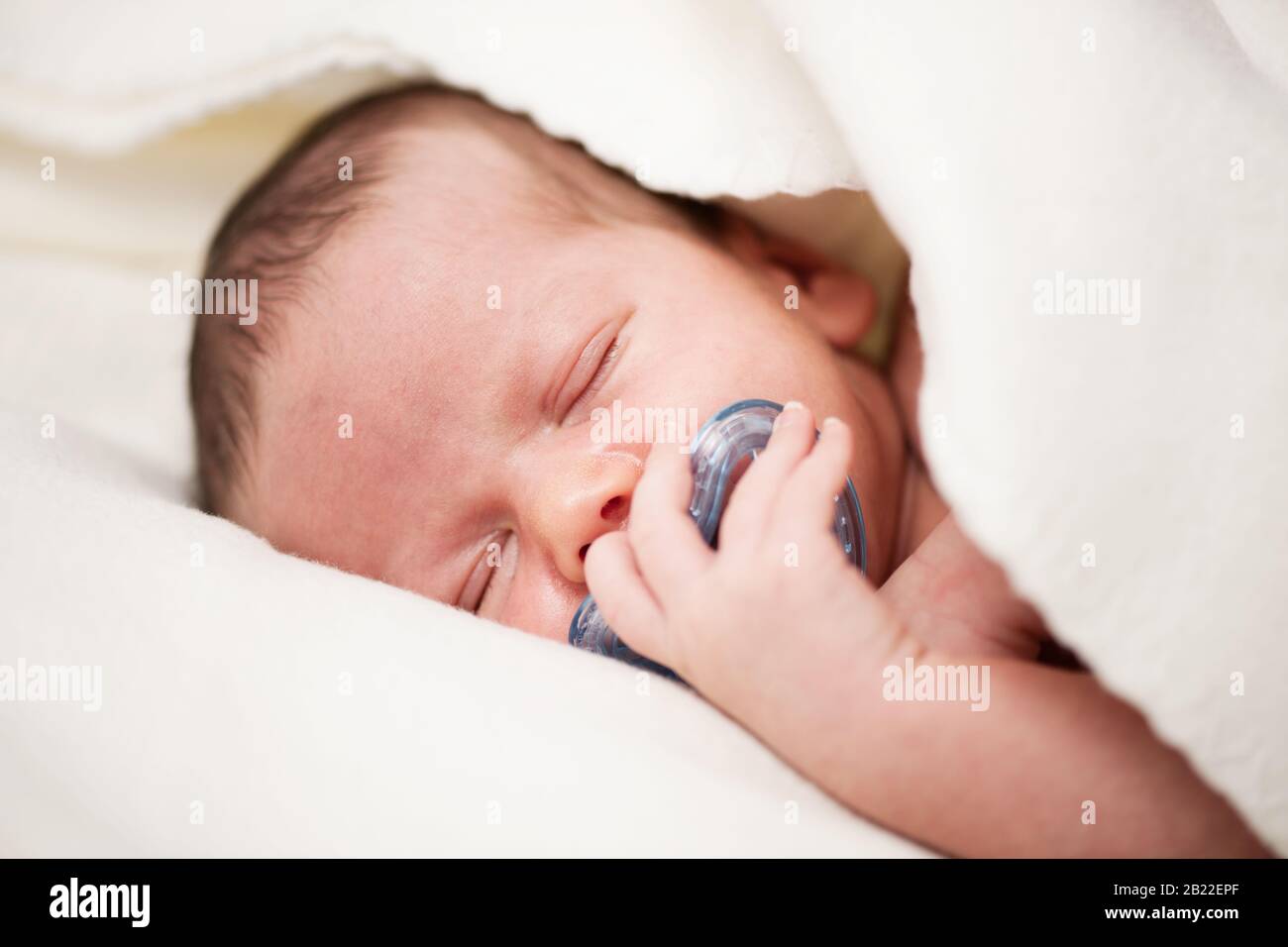 Baby boy sleep with soother in mouth Stock Photo Alamy