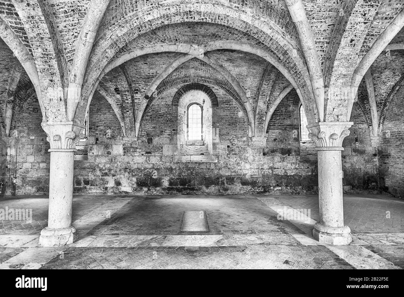 CHIUSDINO, ITALY - JUNE 22: Interior view of the iconic roofless Abbey of San Galgano, a Cistercian Monastery in the town of Chiusdino, province of Si Stock Photo