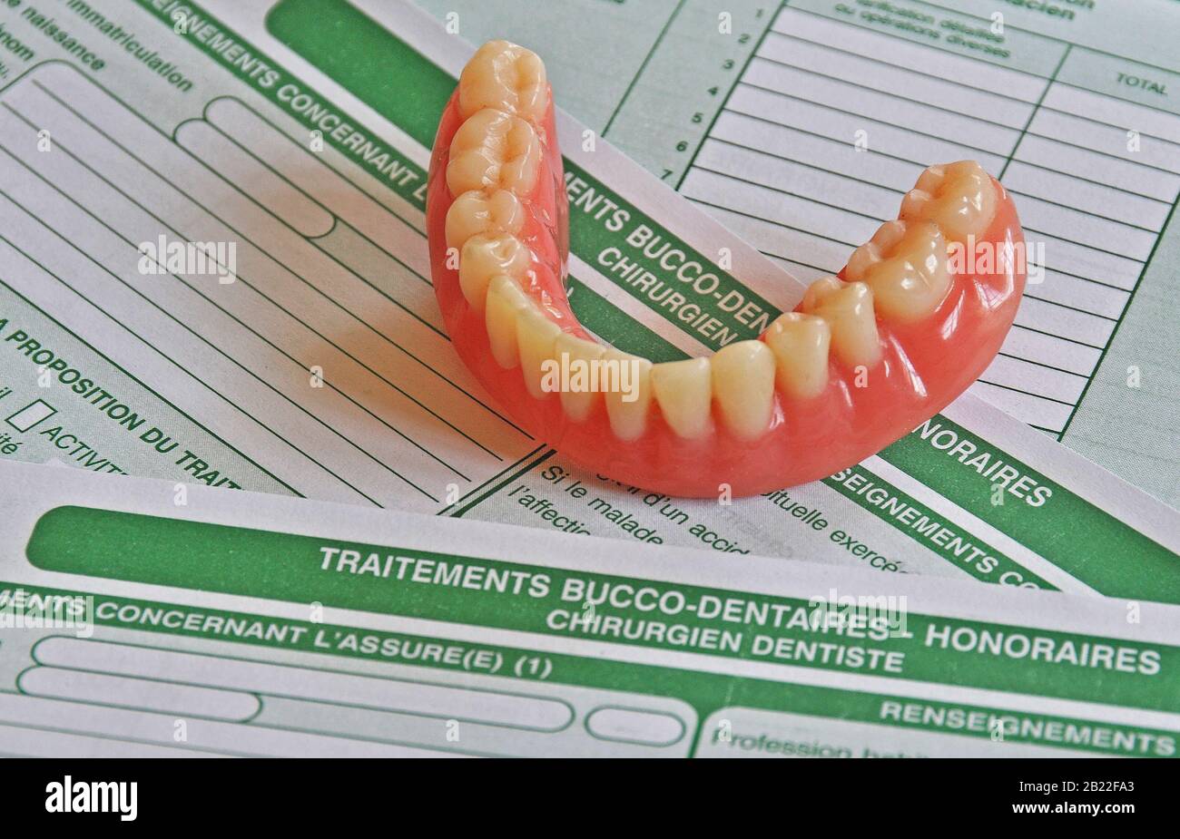dental prosthesis on social security oral care sheets Stock Photo