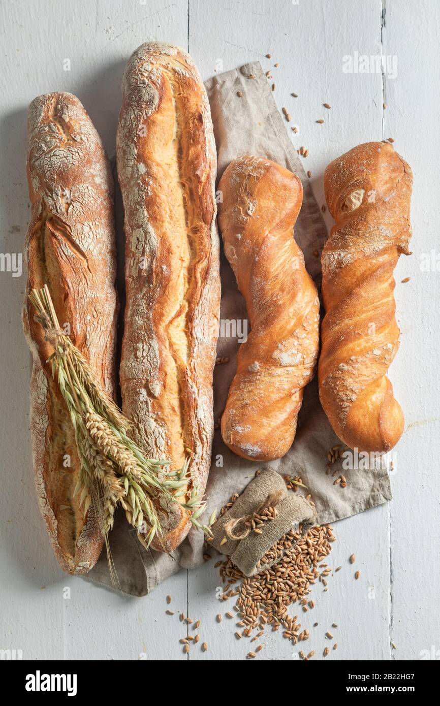 Rustic french baguettes with grains and ears of wheat Stock Photo - Alamy