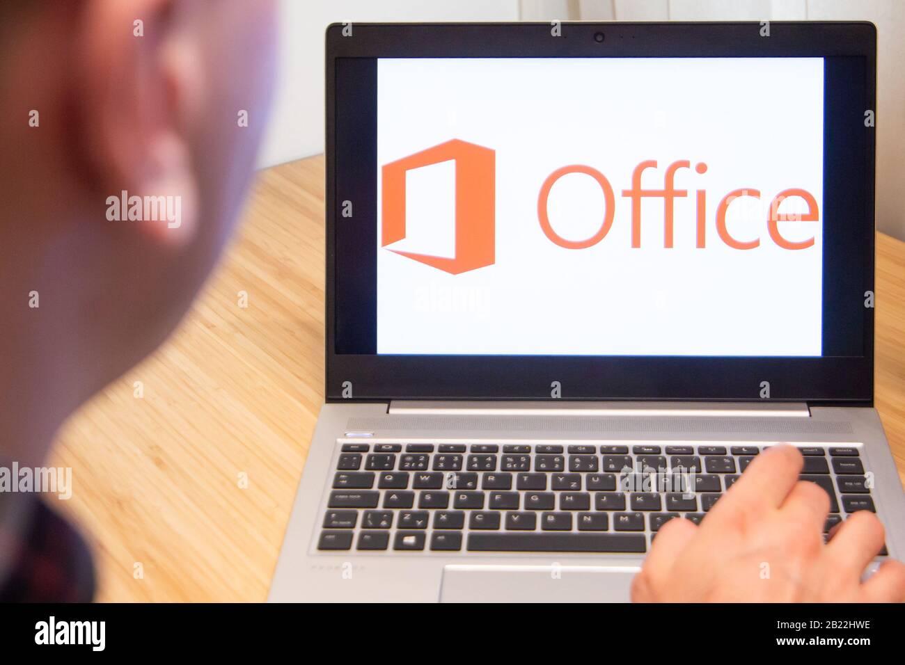 Office 365 is used by a man on the laptop. Microsoft customer used computer software. New product is tested by IT specialist. San Francisco, February Stock Photo