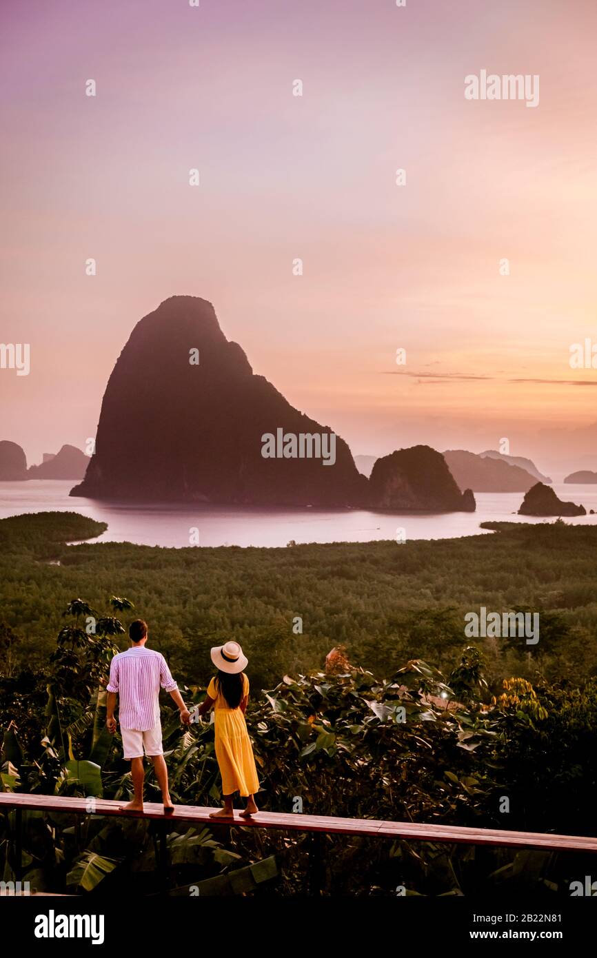 Phangnga Bay during sunrise, couple watching sunrise at the viewpoint Samet Nang Shee Thailand Phangnga province Stock Photo