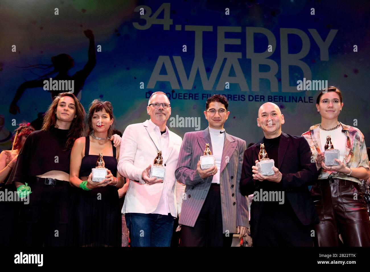 28 February 2020, Berlin: 70th Berlinale, 34th Teddy Award: Producer Magali Merida ('Playback. Ensayo de una despedida', front l-r), Director Agustina Comedi (Best Short Film with 'Playback. Ensayo de una despedida'), director David France ('Activist Award' for 'Welcome to Chechnya'), director Faraz Shariat (Best Feature Film and 'Readers' Award' for 'Future Three'), director Tsai Ming-liang ('Teddy Jury Award' for 'Rizi') and co-author Paulina Lorenz ('Future Three'). The queer film prize has been awarded at the Berlinale since 1987. The International Film Festival takes place from 20.02. to Stock Photo