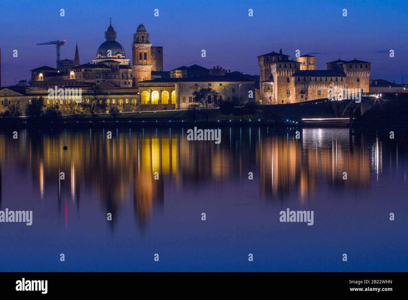 Twilight over Mantova skyline reflected in Lago Inferiore, Lombardy, Italy Stock Photo