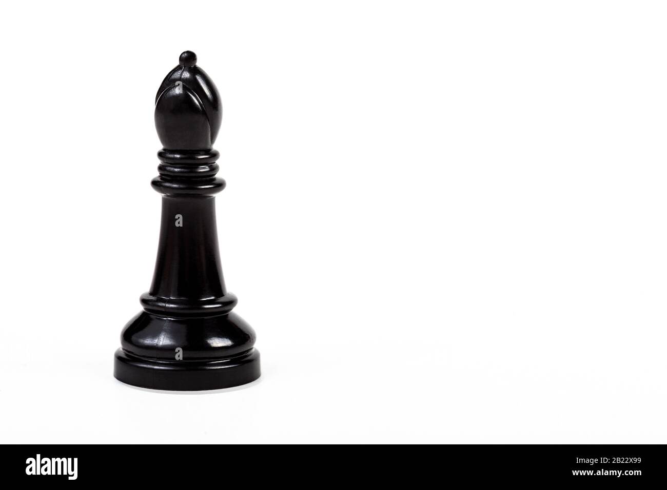 Simple one single shiny black bishop chess piece figure alone ...