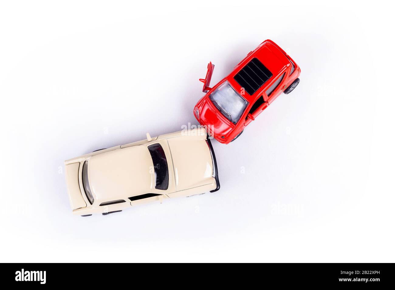 Two mini toy car crash, incident, car traffic accident, frontal collision top view, vehicle insurance abstract concept, damaged broken cars, cracked Stock Photo