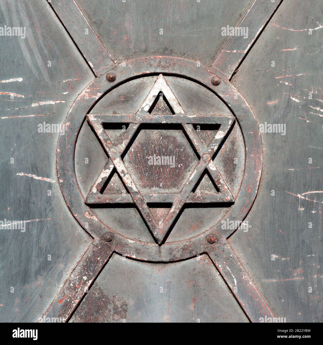 Star of David, old damaged metal door architectural building part, synagogue detail circle square symbol, sign closeup, Judaism, Jewish, Israeli Stock Photo