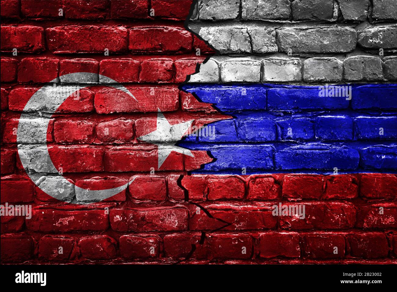 Closeup, flags of Turkey against Russia on a cracked brick wall background. Concept of crisis of war and political conflicts between nations Stock Photo