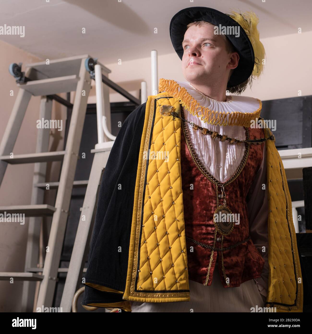 Actor dressed historical costume in interior of old theater Stock Photo ...