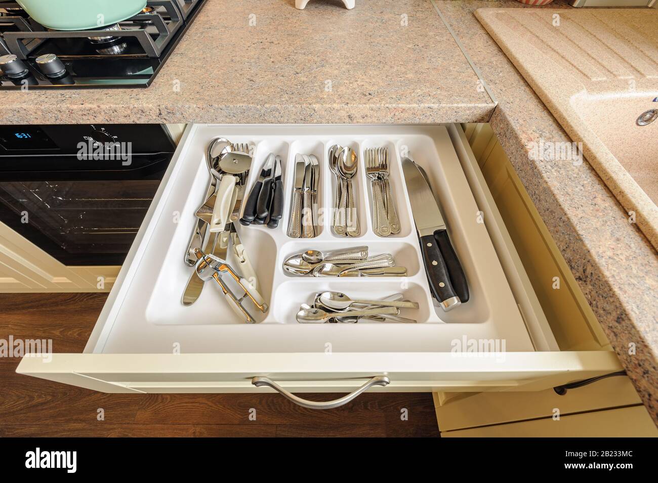 open kitchen drawer with silverware inside Stock Photo Alamy