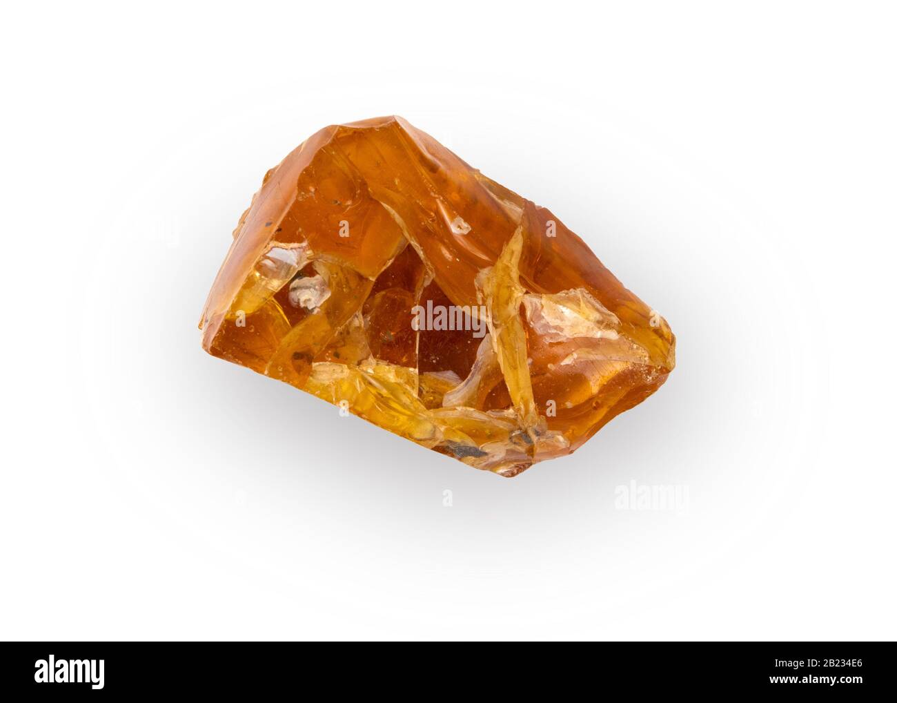 Piece of natural raw amber with white inclusions isolated on white background Stock Photo