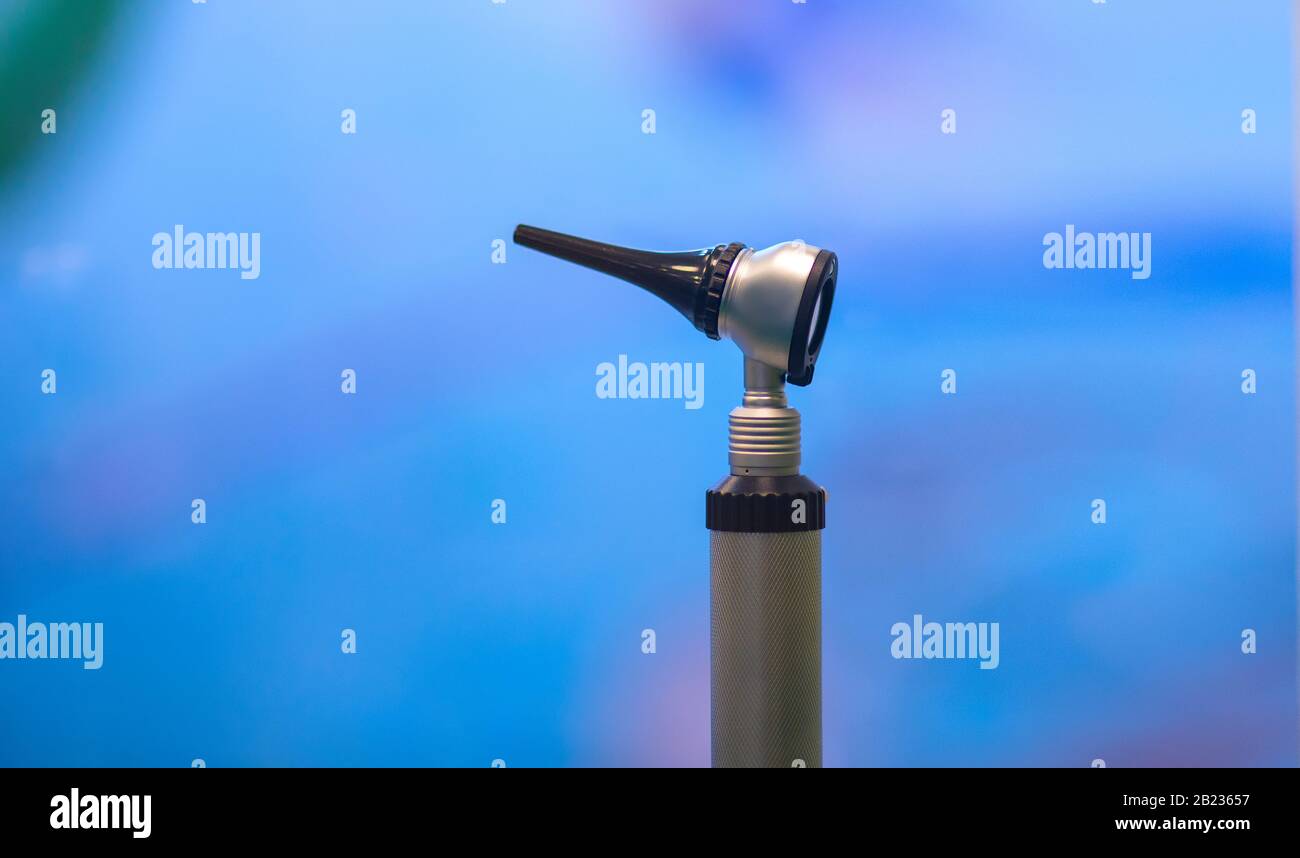 Medical Equipment Otoscope for ear on blue background copy space Stock
