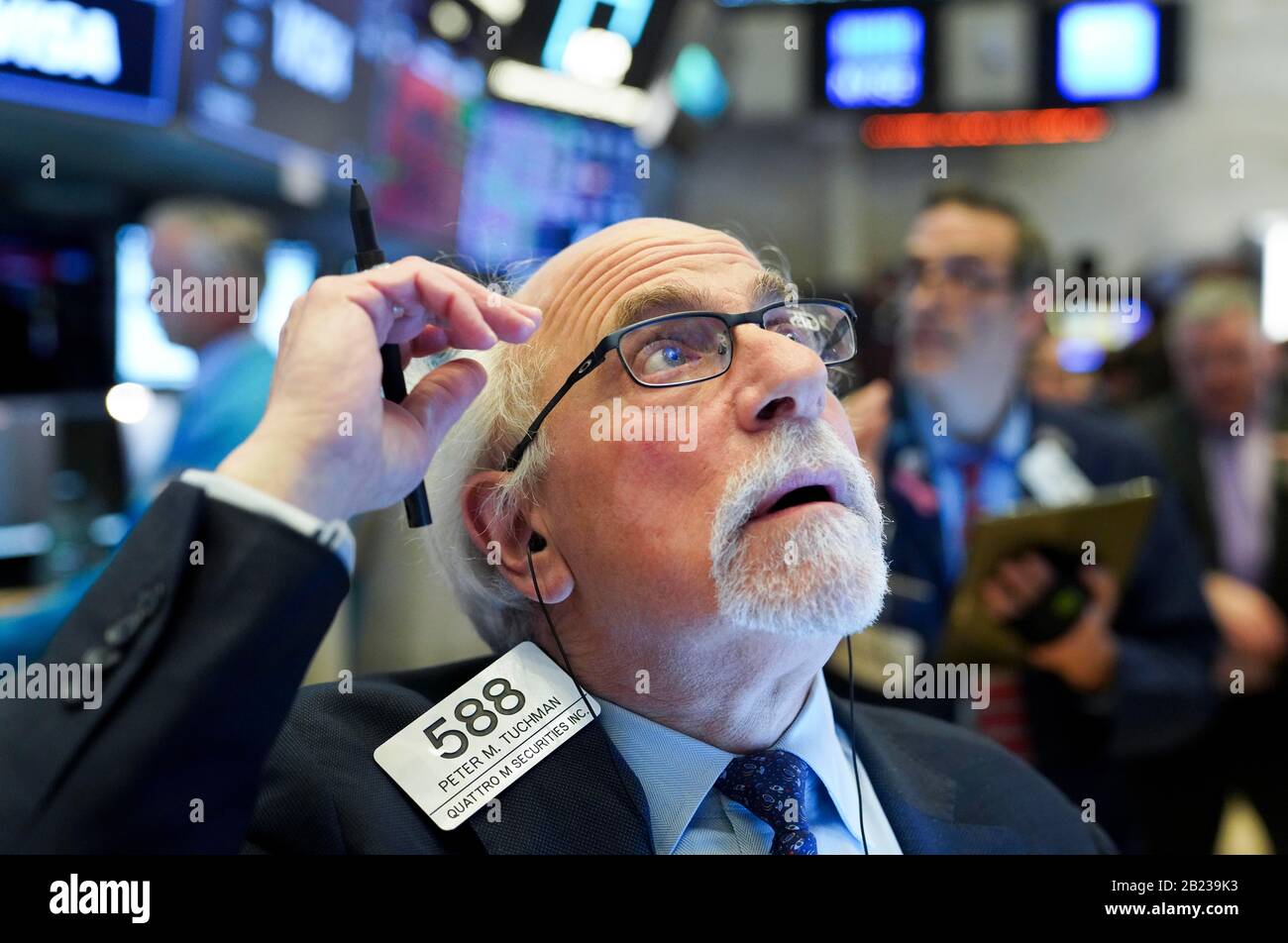 Beijing, USA. 27th Feb, 2020. A trader works at New York Stock Exchange in New York, the United States, Feb. 27, 2020. U.S. stocks closed sharply lower on Feb. 27 as investors fled the stocks market and flocked into safe-haven assets. Credit: Wang Ying/Xinhua/Alamy Live News Stock Photo