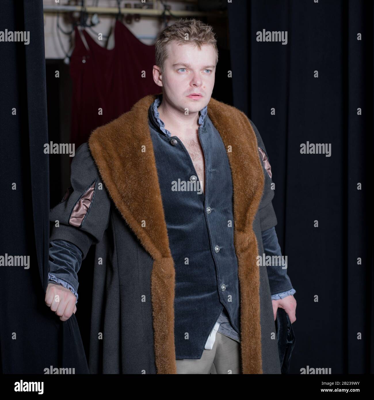 Actor dressed historical costume in interior of old theater Stock Photo ...
