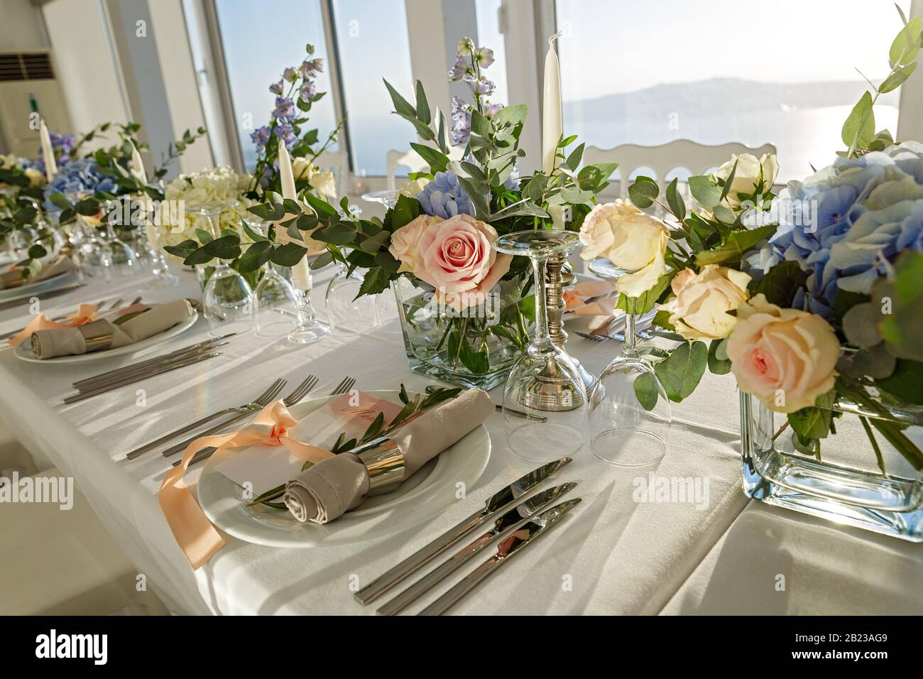 Set table for a wedding with bouquets of flowers Stock Photo