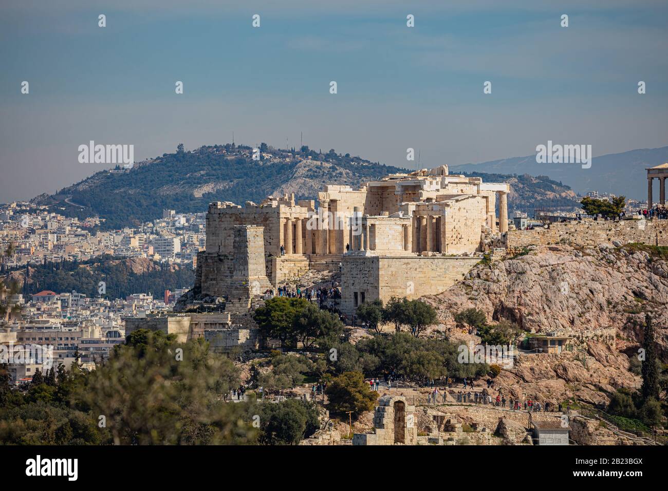 Athens, Greece. Acropolis propylaea propylea or propylaia entrance gateway and monument Agrippa pedestal, view from Philopappos Hill. Stock Photo