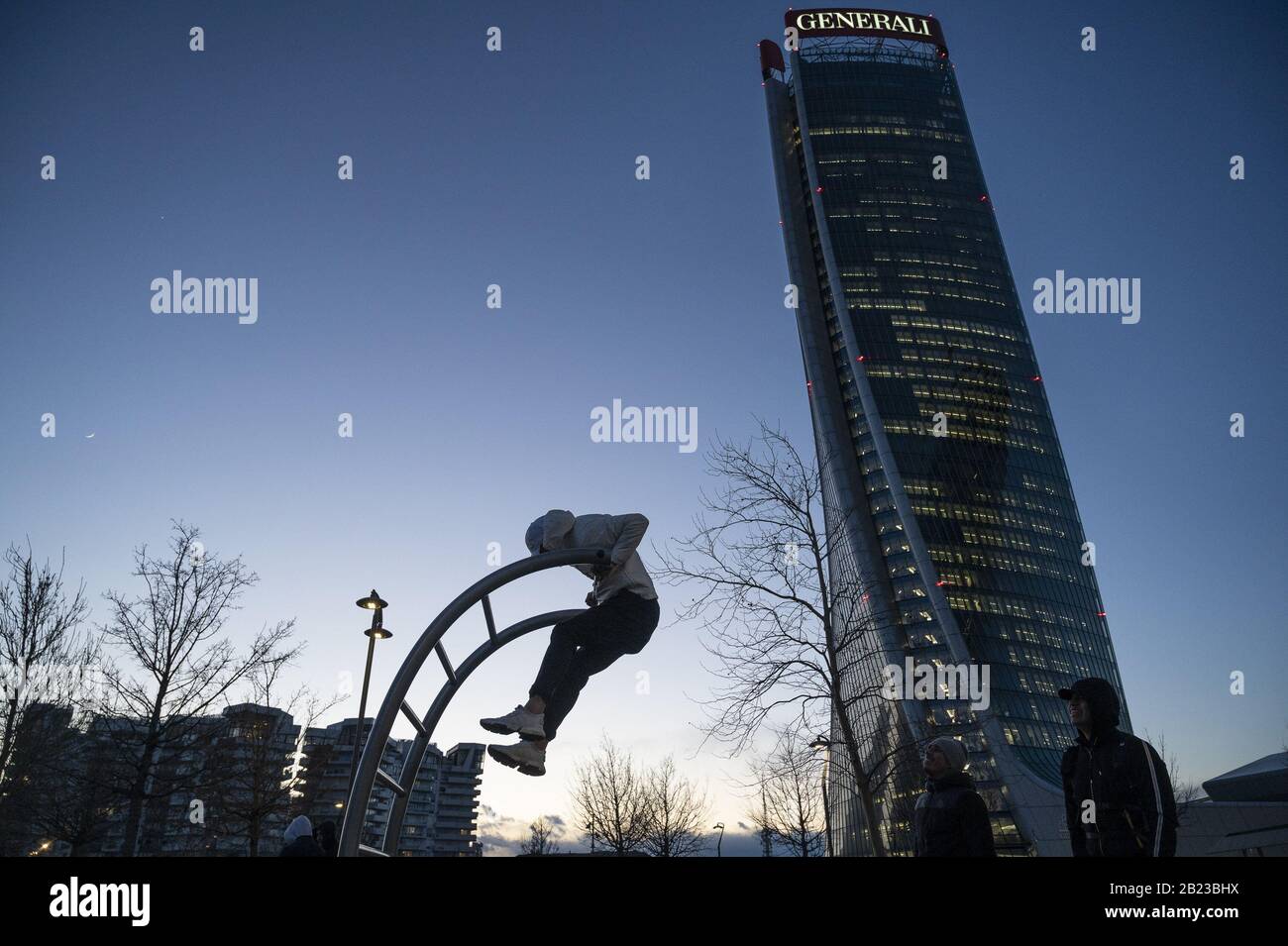 Milan, Italy. 26th Feb, 2020. A man exercises out in open air as gyms were closed amid Coronavirus fears.According to the regional decree affirming the closure of shops in shopping malls for the COVID-19 emergency, and the cancellation of Milan's carnival activities, only restaurants, supermarkets and pharmacies will be open during the weekend (29th February and 1st March 2020) in the entire prestigious CityLife Shopping District Mall in Milan. Credit: Valeria Ferraro/SOPA Images/ZUMA Wire/Alamy Live News Stock Photo