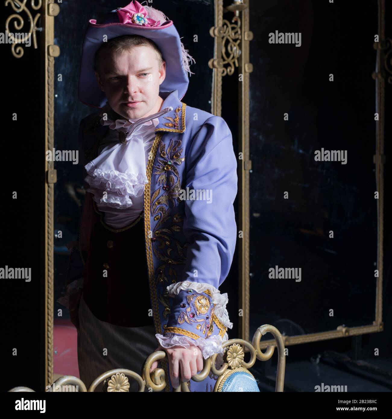 Actor dressed historical costume in interior of old theater Stock Photo ...