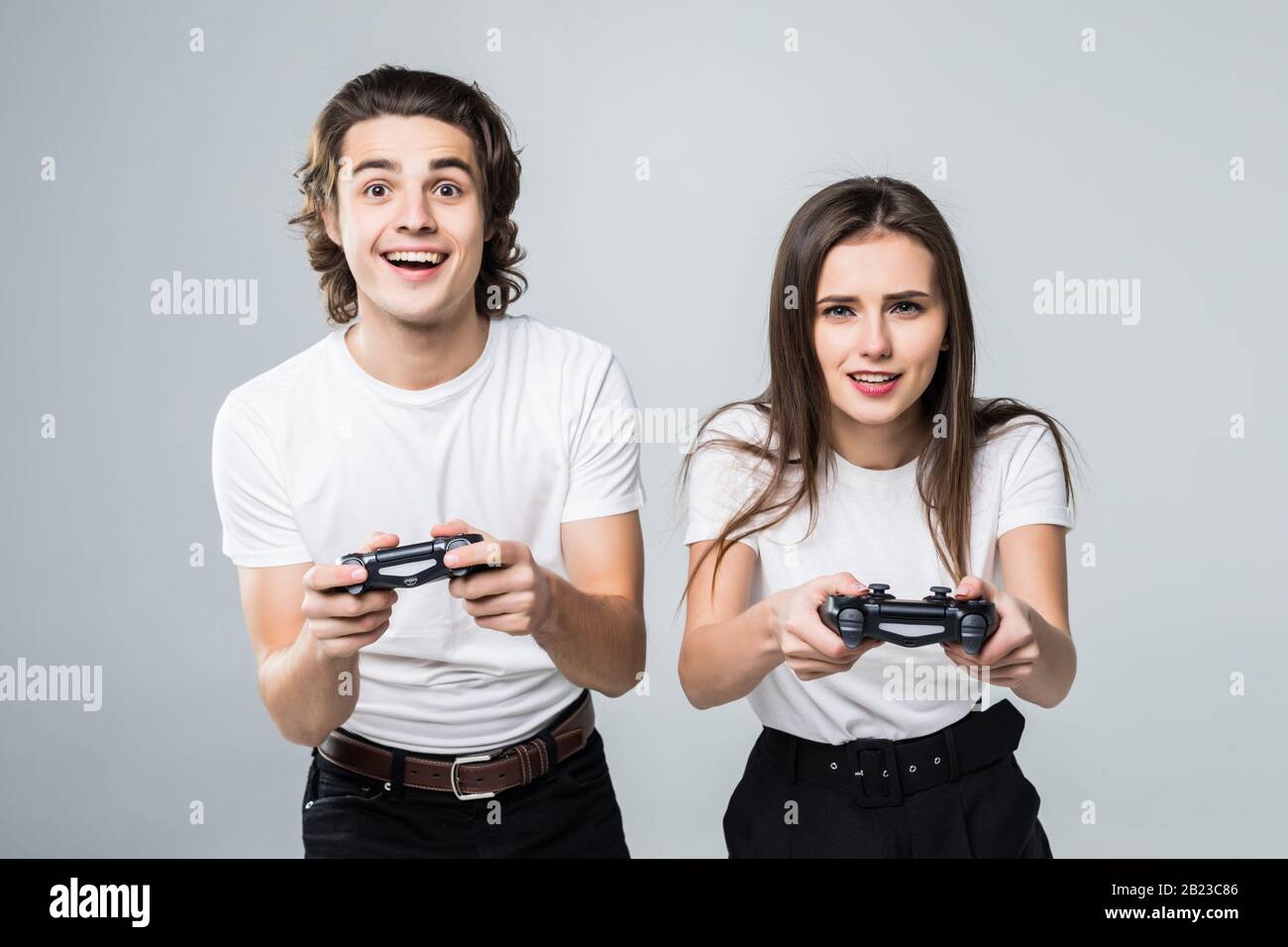 Pleased young man playing games hi-res stock photography and images - Alamy
