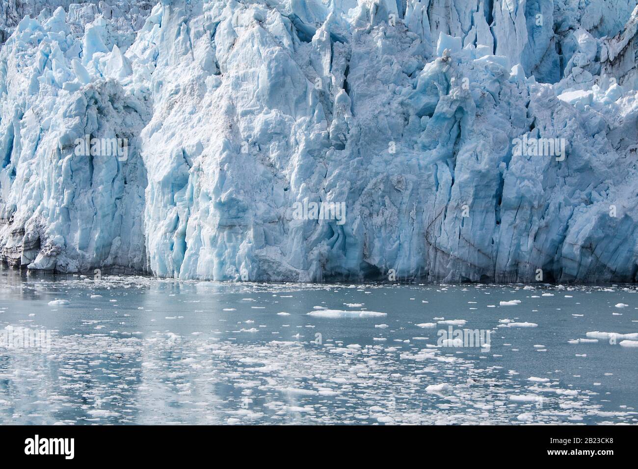 Alaska, USA: Close up view of Surprise Glacier in Prince William Sound (Gulf of Alaska) with reflections on ice lake Stock Photo