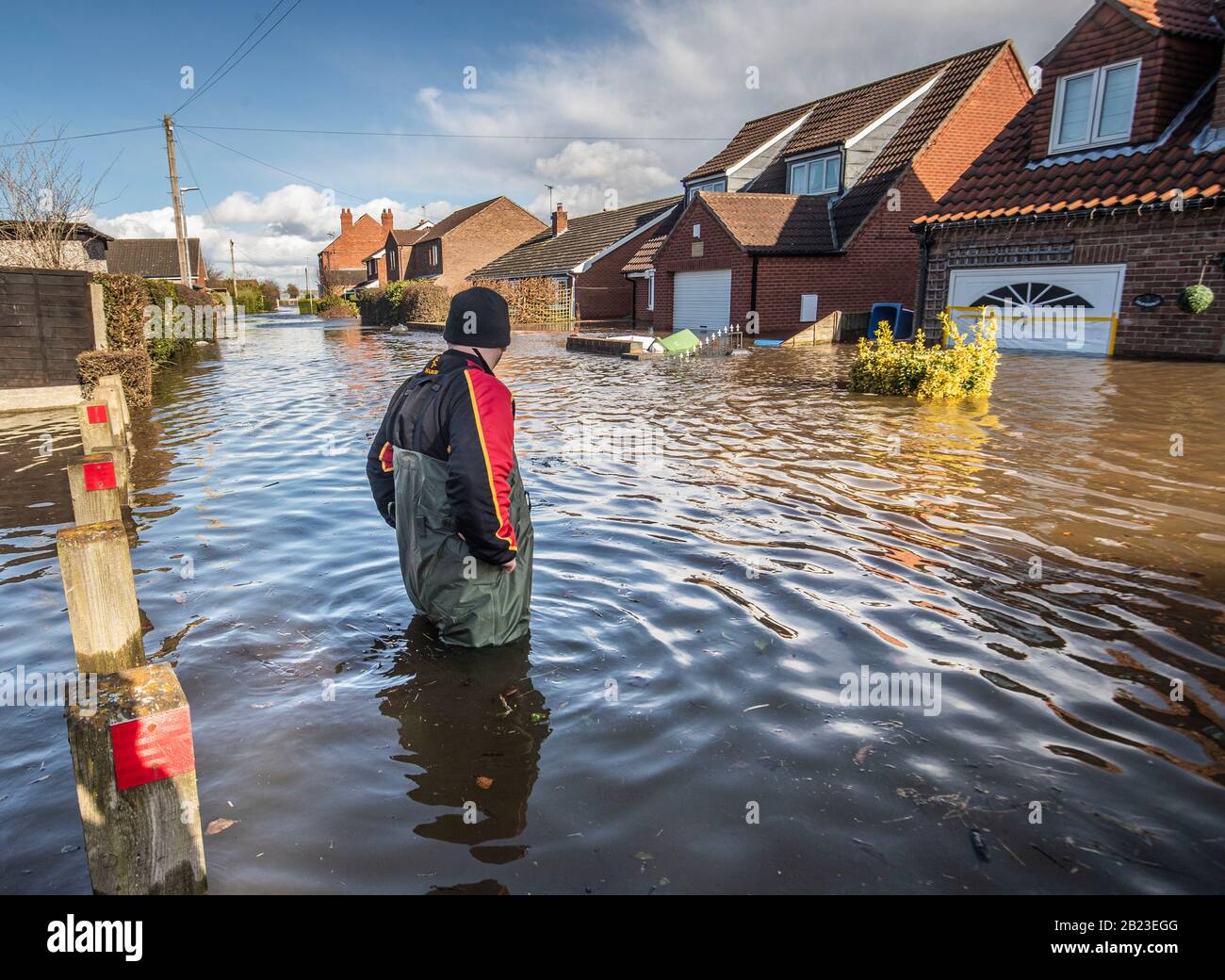 A man in the flooded village of East Cowick, Yorkshire, after heavy