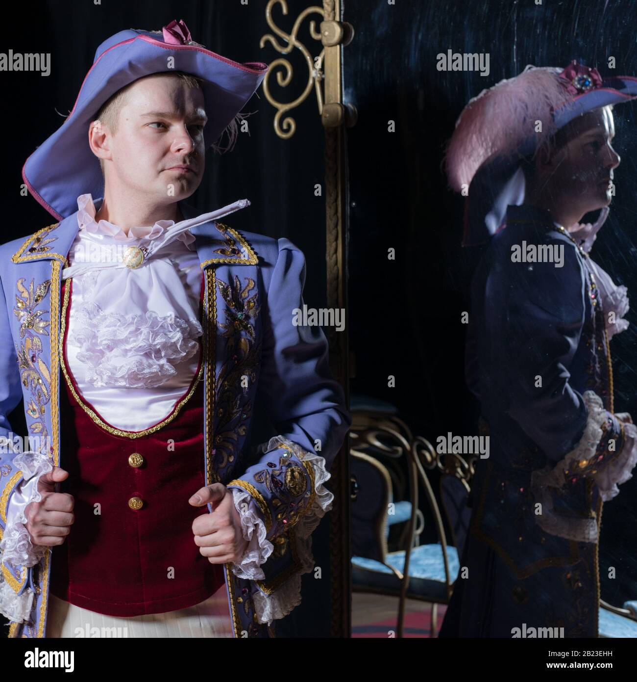 Actor dressed historical costume in interior of old theater Stock Photo ...