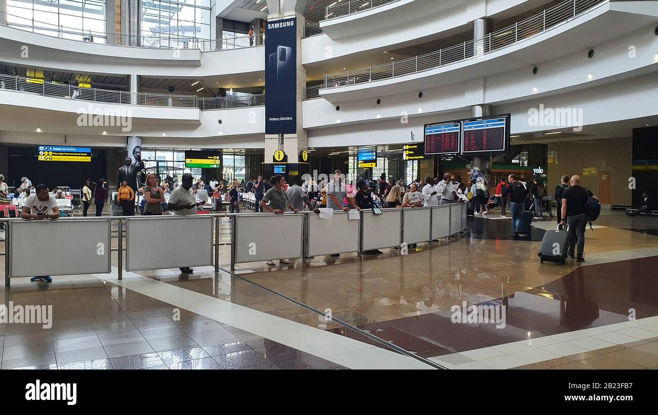 Johannesburg, South Africa - 18 Feb 2020: The ariport in Johannesburg in South Africa where people are busy moving on, arrival hall. Stock Photo
