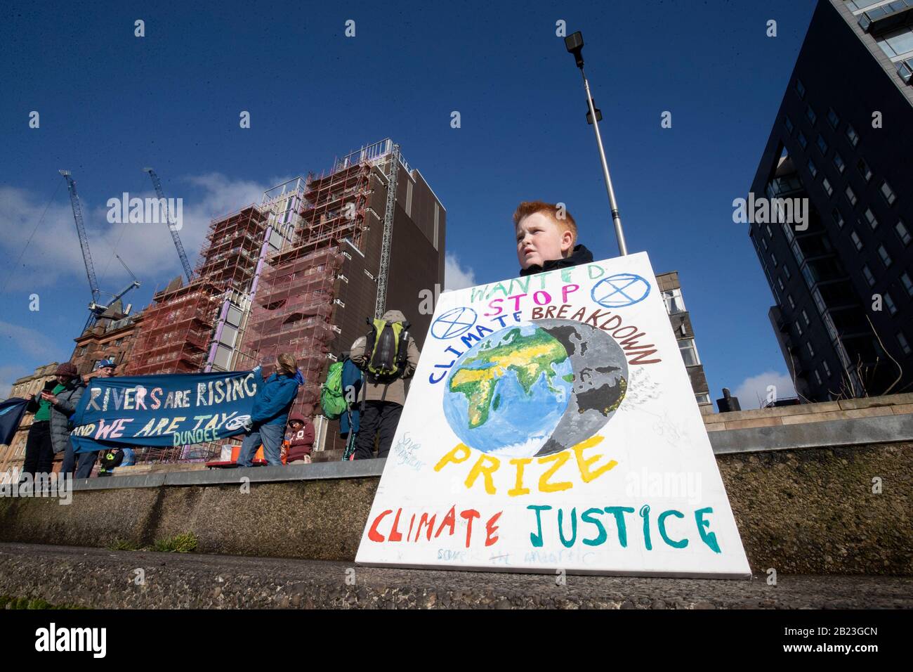 Some of the hundreds of people that took part in the Blue Wave parade organised by Extinction Rebellion through Glasgow city centre to raise awareness of the dangers Glasgow and the world faces from flooding caused by rising sea levels and an increased occurrence of storms. Stock Photo