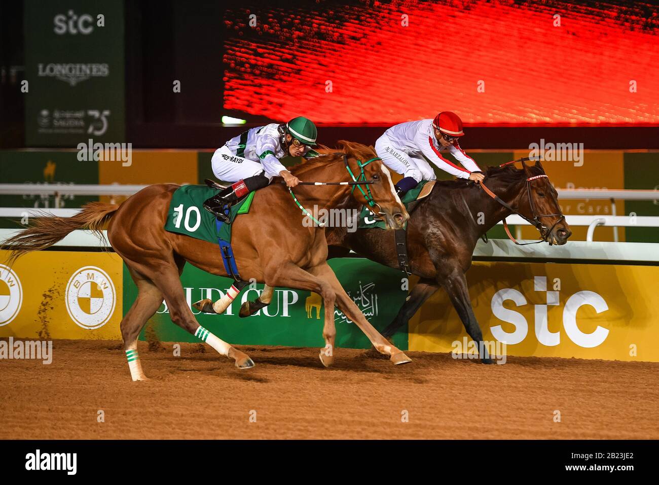 Riyadh, Saudi Arabia. 29th February 2020. Saudi jockey Adel Alfouradi (L)  on his way to victory with OMSIYAATEE in the Jockey Club Cup race at the  inaugural Saudi Cup Credit: Feroz Khan/Alamy