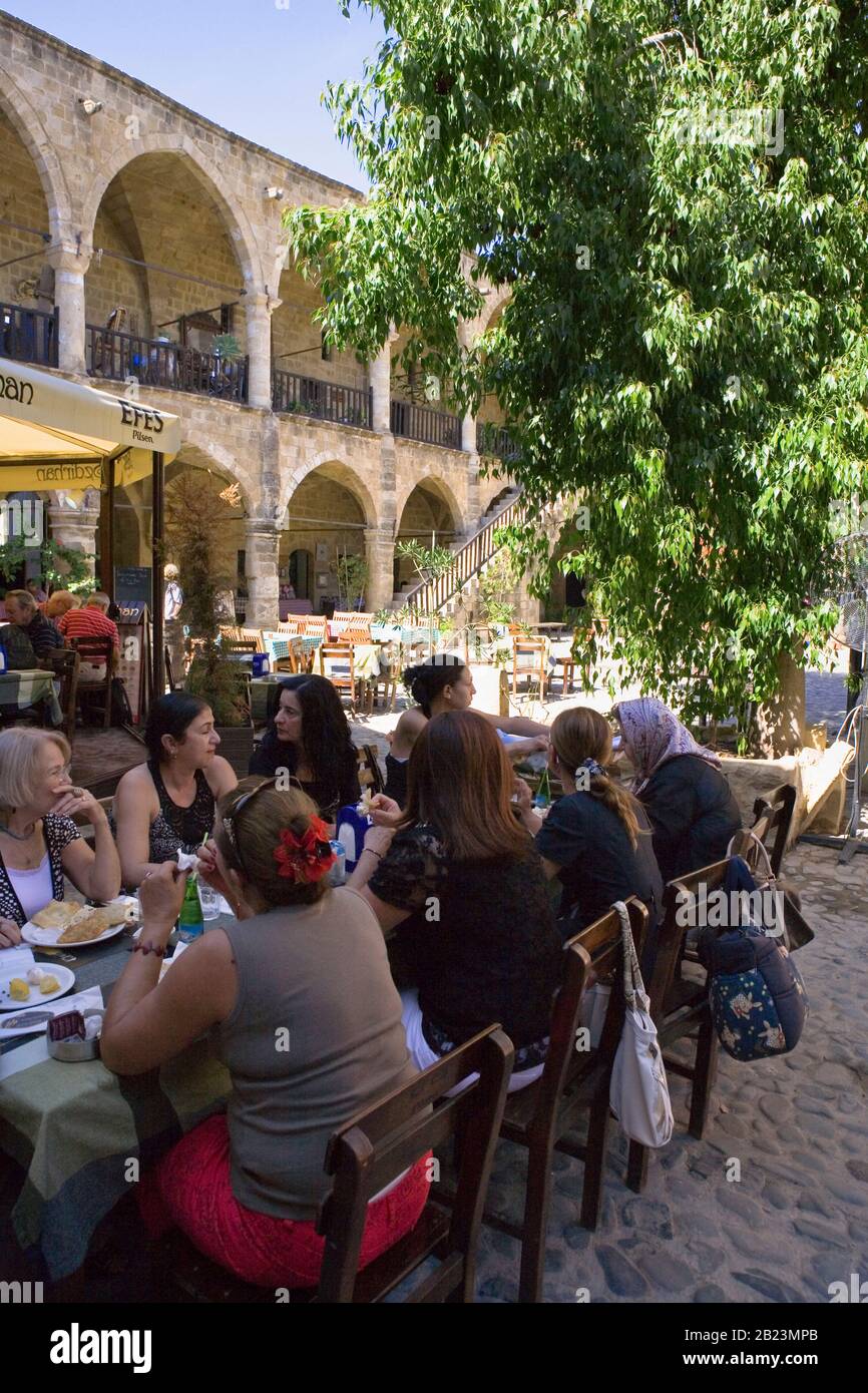 Ladies lunching in the courtyard of the Büyük Han, the famous caravanserai on Asmaalti Sokak, North Nicosia Stock Photo