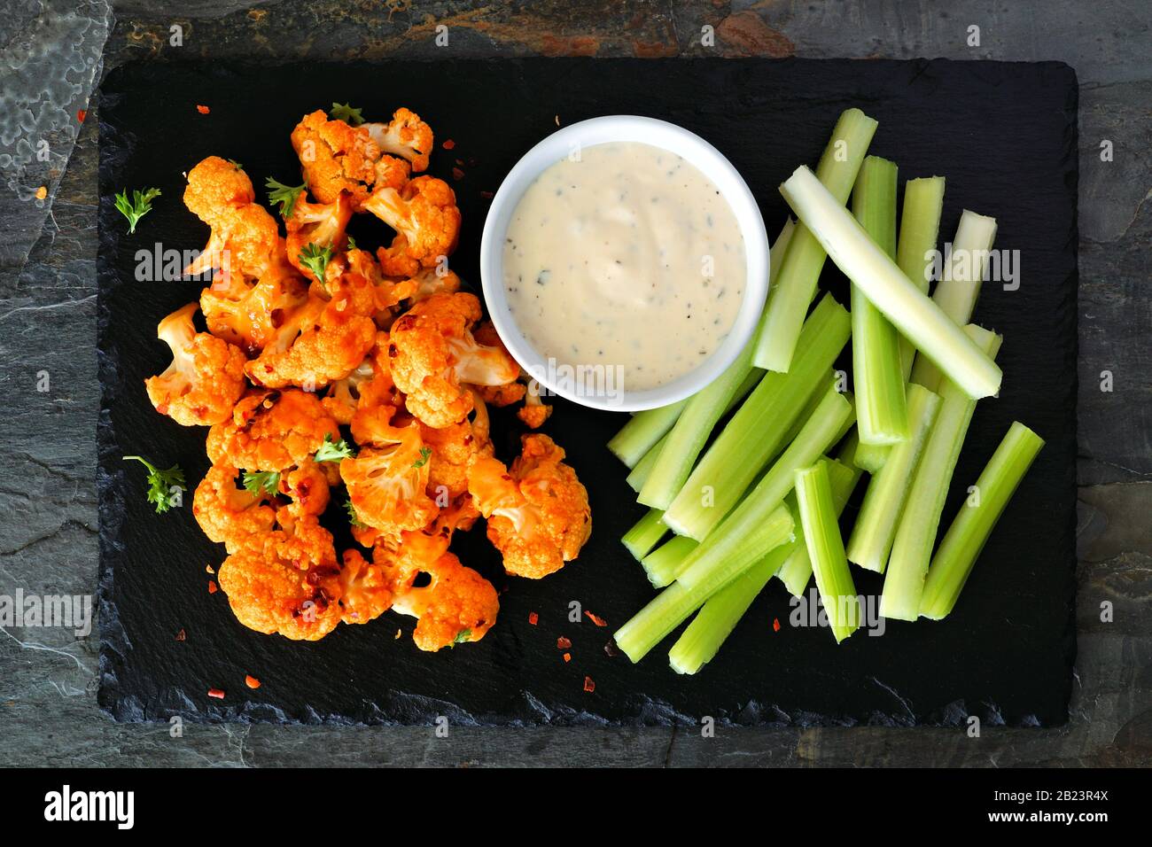 krone Andrew Halliday så Cauliflower buffalo wings with celery and ranch dip. Top view on a slate  serving platter. Healthy eating, plant based meat substitute concept Stock  Photo - Alamy