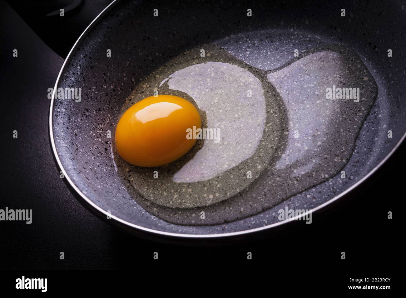 raw egg in the pan Stock Photo