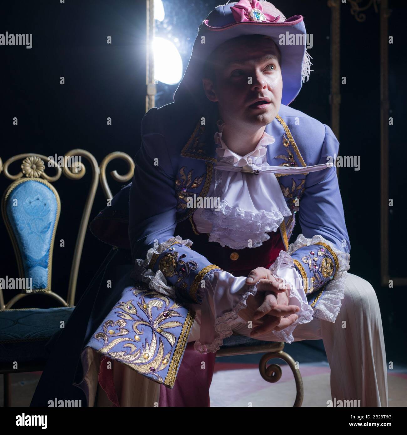 Actor dressed historical costume in interior of old theater Stock Photo ...