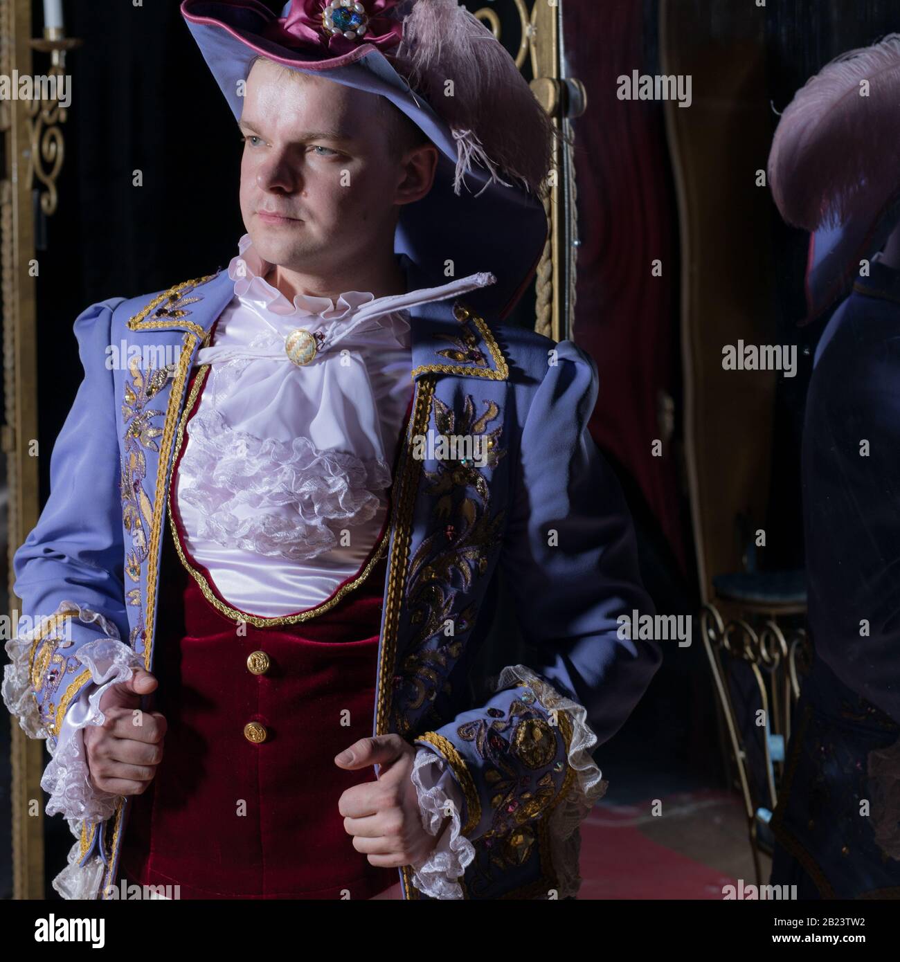 Actor dressed historical costume in interior of old theater Stock Photo ...